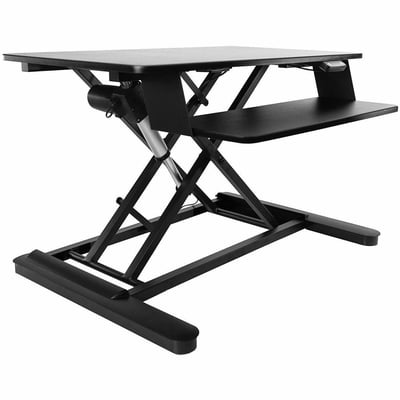 THE FREEDOM E-DESK DESKTOP CONVERTER FITS DUAL 24IN MONITORS AND SUPPORTS UP TO